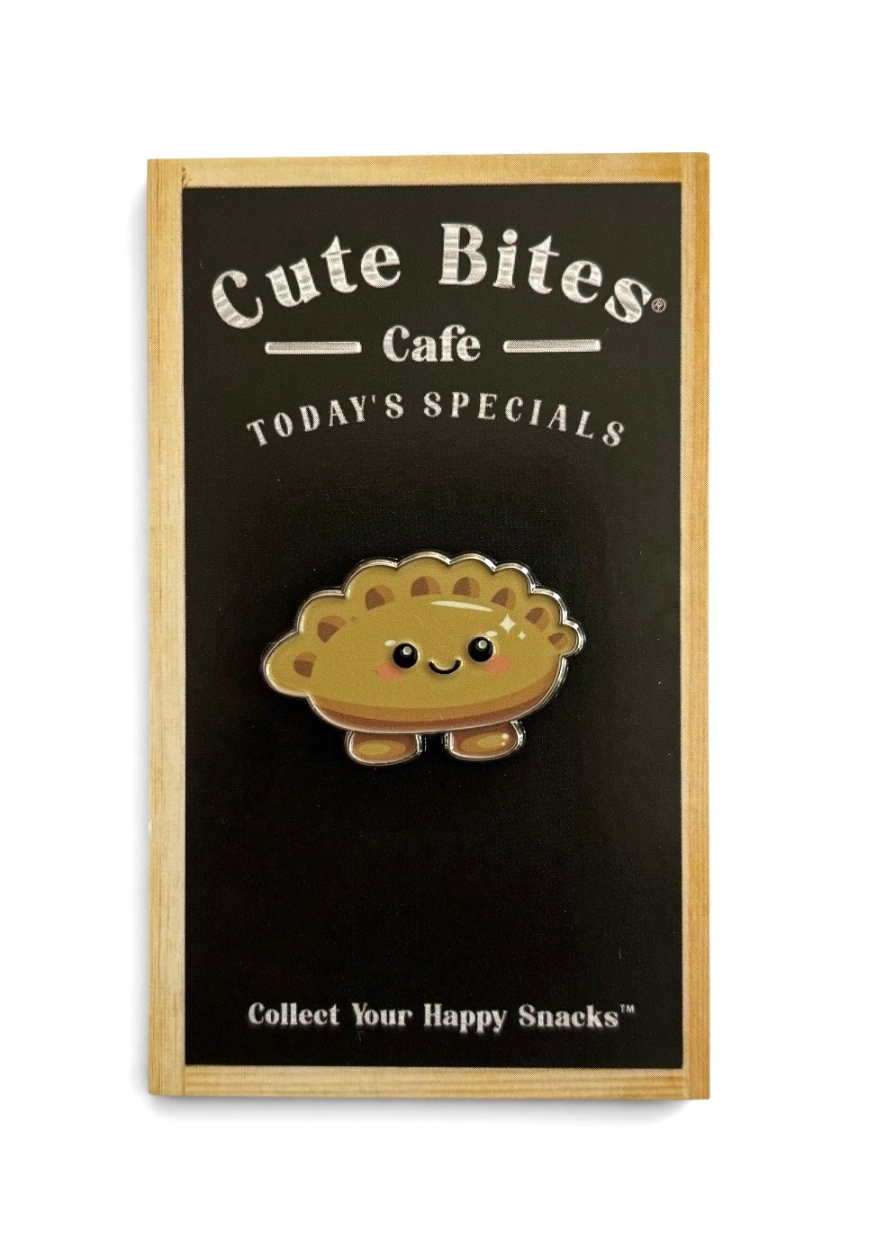 A cute, smiling cheerful gyoza enamel pin displayed on a black sign that reads 'Cute Bites Cafe' and 'TODAY'S SPECIALS'.
Copyright © Cute Bites® All rights reserved.