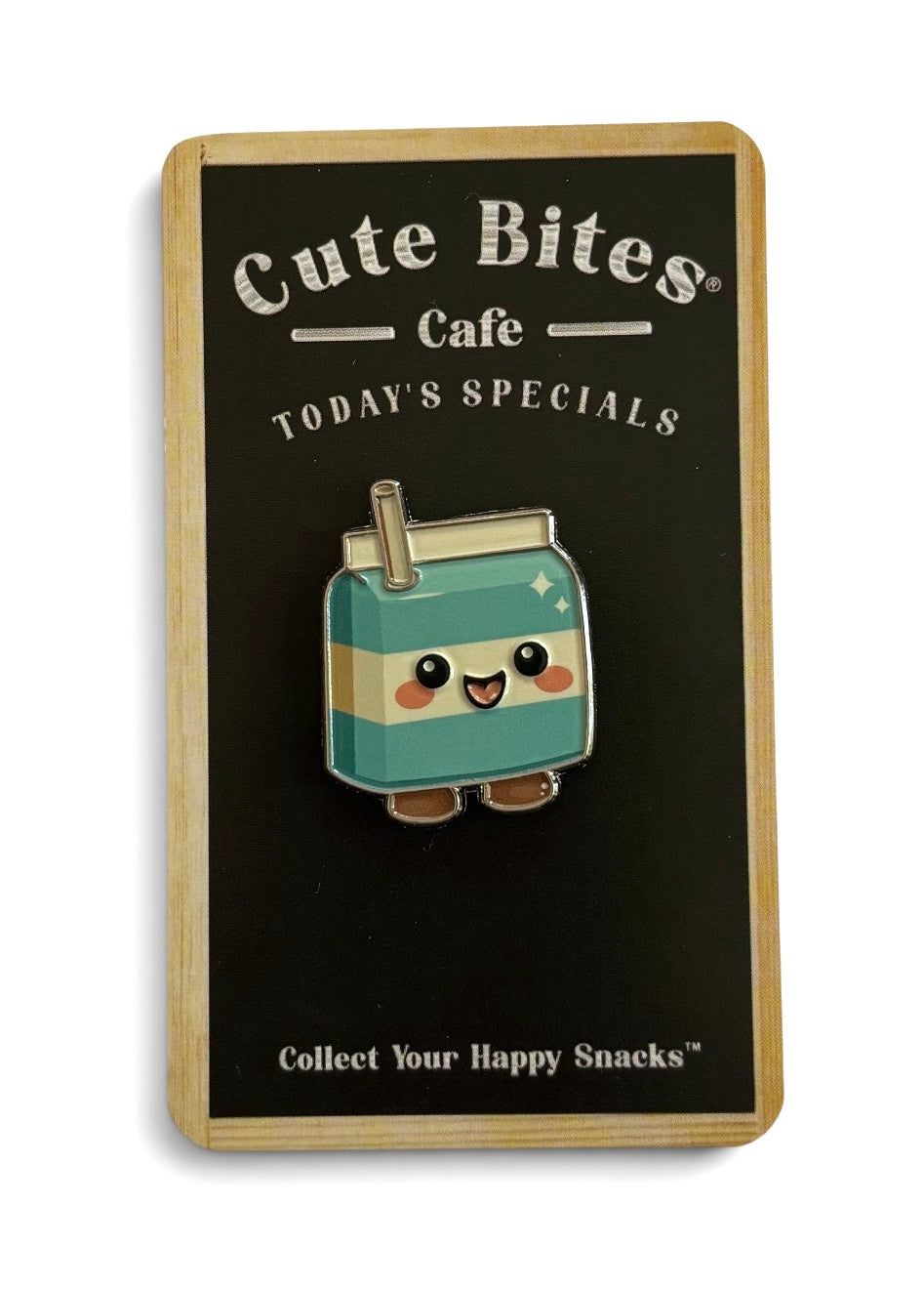 A cute enamel pin shaped like a smiling cool milk carton with a straw, mounted on a black display card.
Copyright © Cute Bites® All rights reserved.